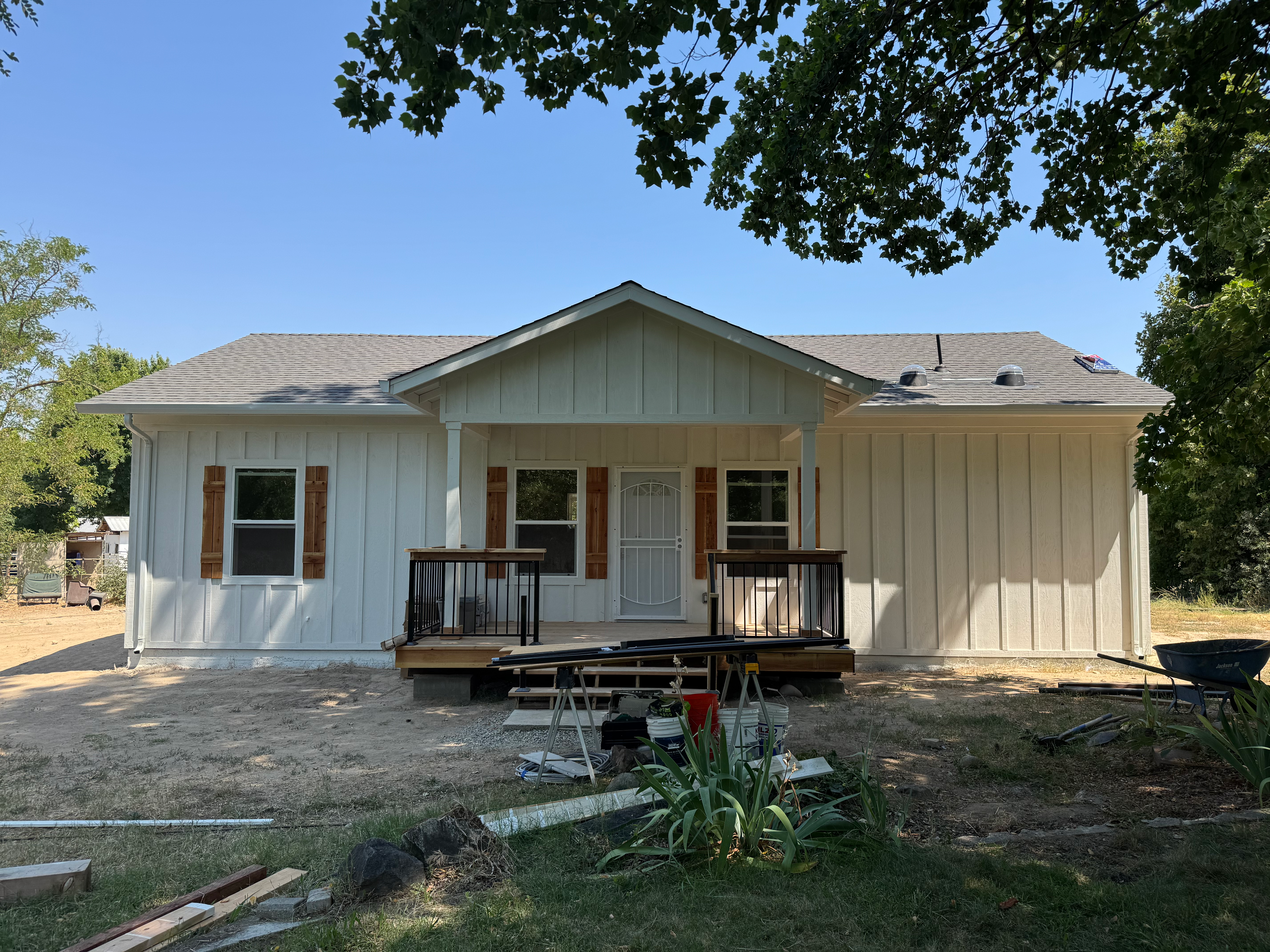 Completed ADU with board and batten siding and front porch