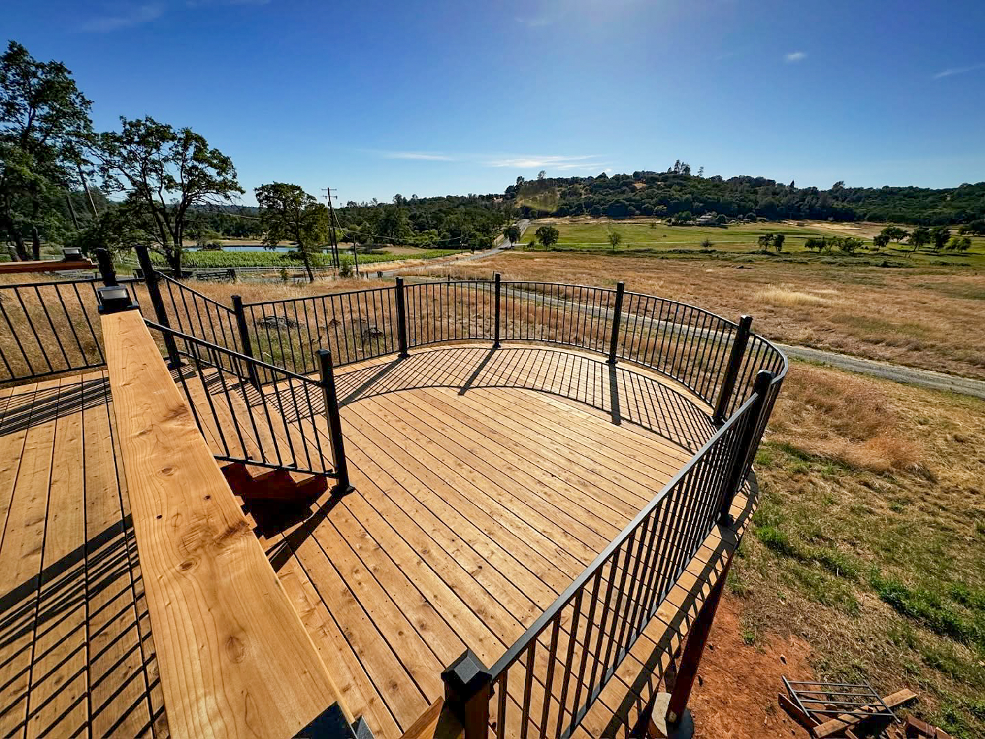 Curved elevated deck with railing