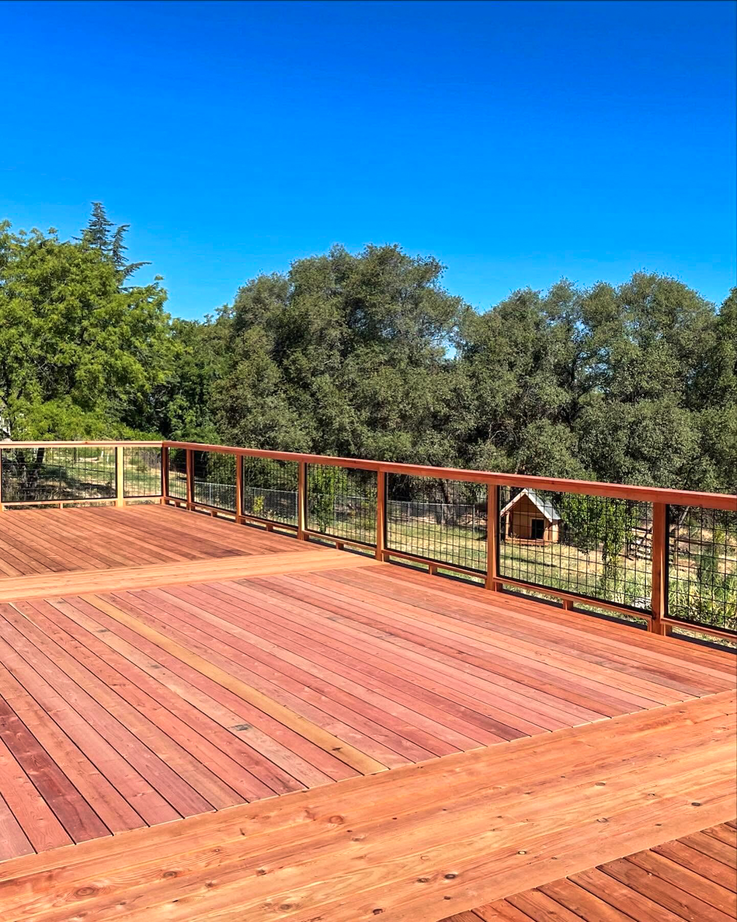 Redwood deck with mesh railing