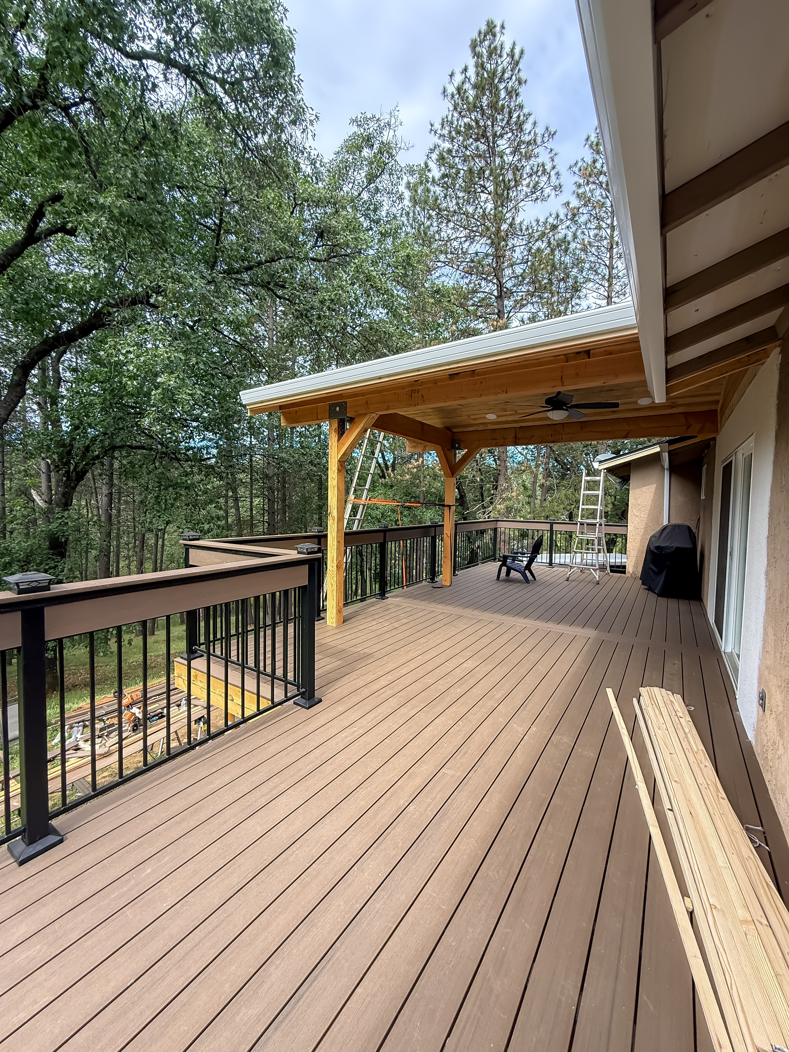 Finished composite deck with timber-frame patio cover