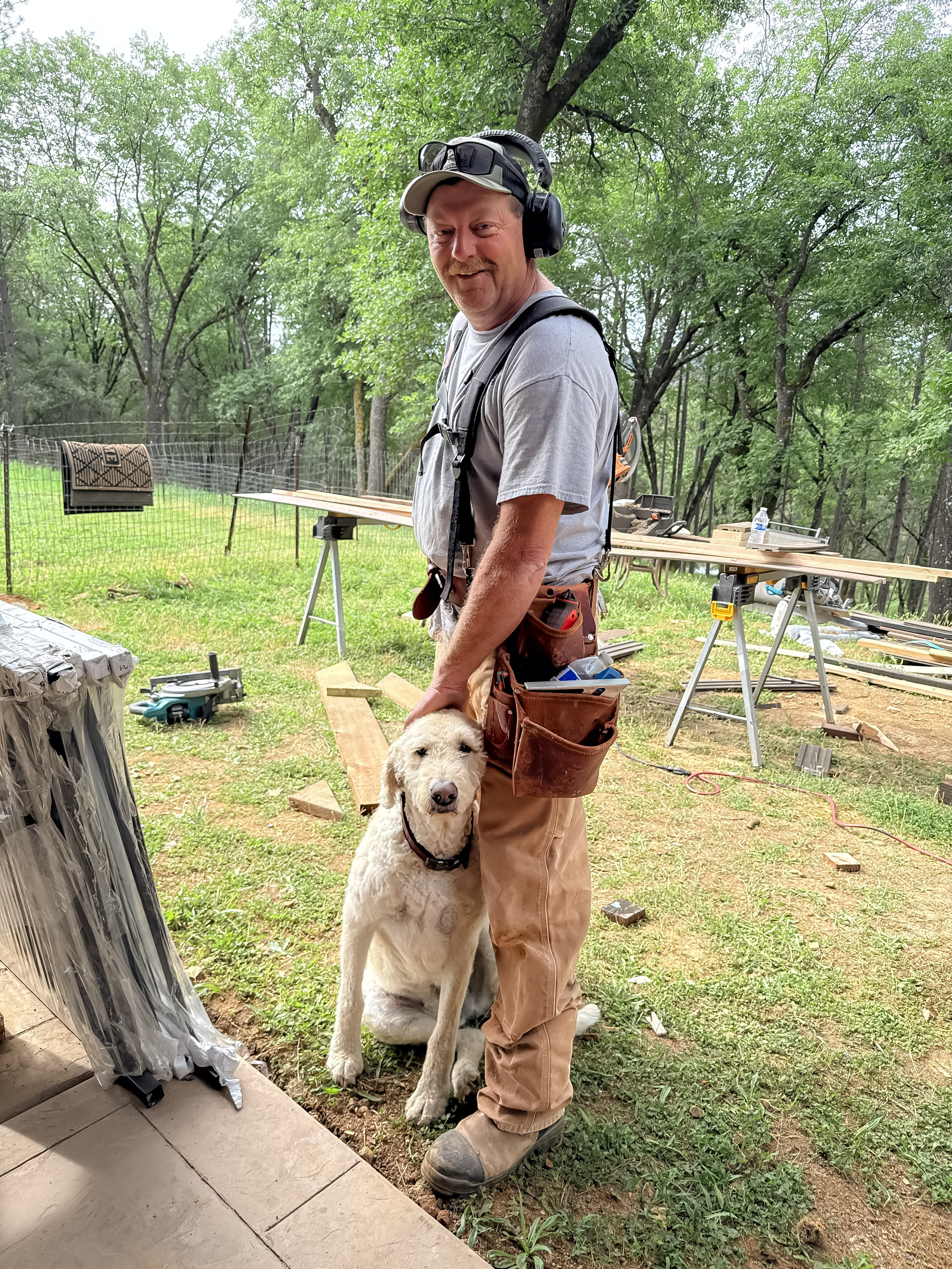 Team member with job site dog